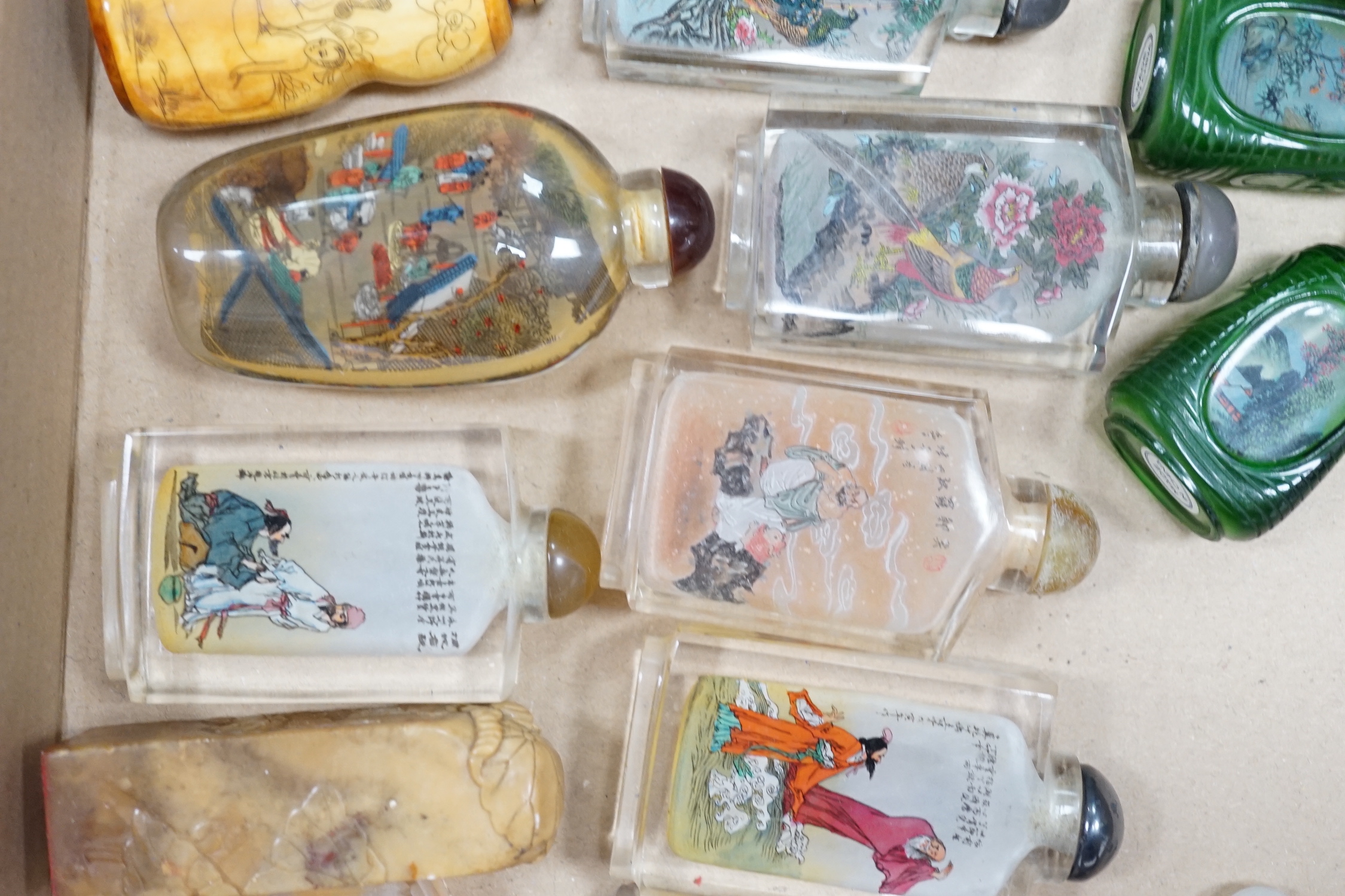 A collection of Chinese snuff bottles, mostly reverse painted (2 trays)